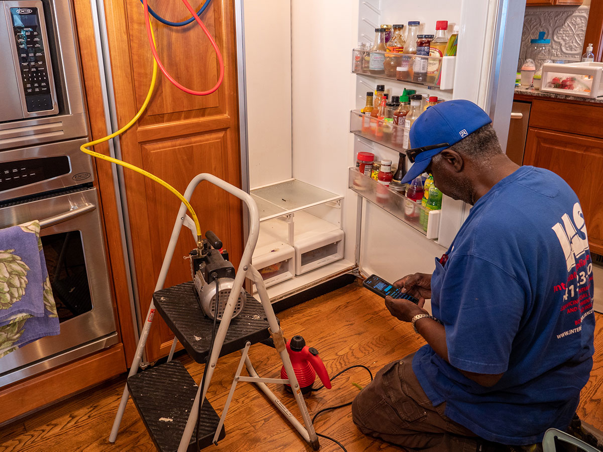 A Technician Repairs a Sub-Zero Refrigerator